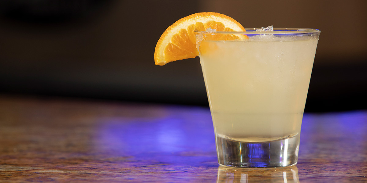 Cocktail with orange wedge